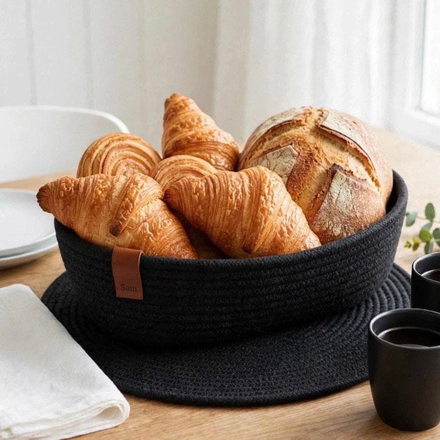 A black cotton breadbasket
