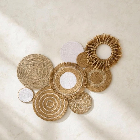 cluster wall decor made of eight round woven jute discs in beige and white with fringe and spiral patterns, handmade boho wall art by Sam Crafty Gallery